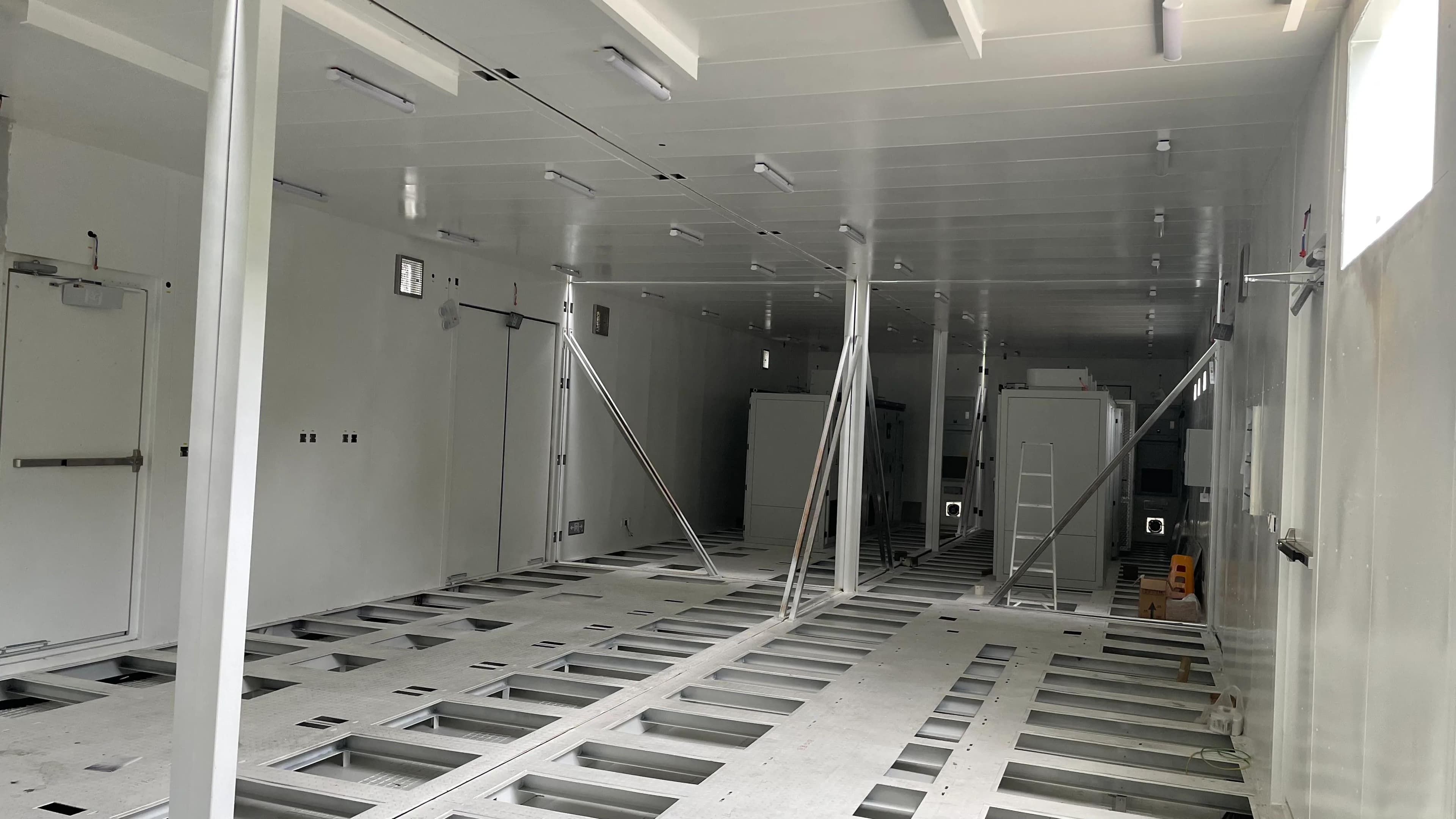 Equipment bases and maintenance aisle after double-bay assembly